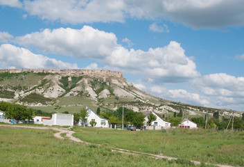 Fototapeta na wymiar White Rock (Ak-Kaya) and the same name village at its foot, Crimea