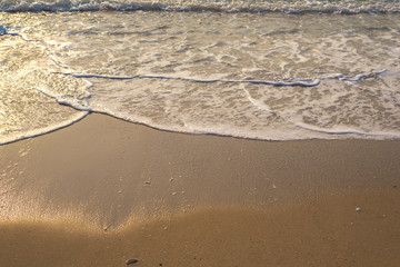 wave in sand beach