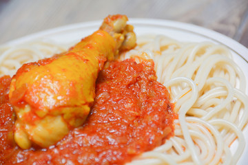 Tasty noodles with tomato sauce and chicken