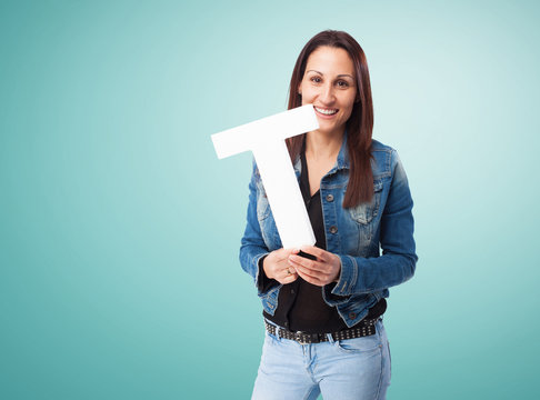 woman holding the T letter
