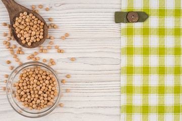 Chickpeas on old wooden table.