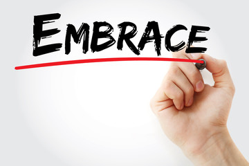 Hand writing Embrace with marker, concept background