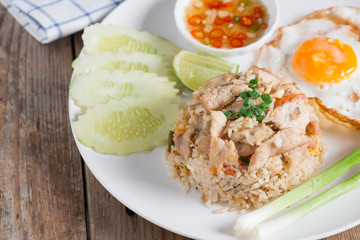 Pork fried rice and fried egg with vegetable.