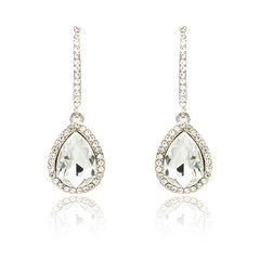 Pair of silver diamond earrings isolated on white