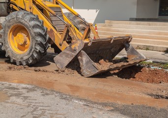 Fototapeta premium Excavator working on the Repair of pipe water 