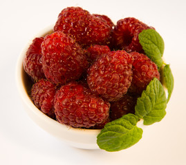 raspberries in a white plate