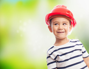 portrait of a little boy wearing a mason helmet