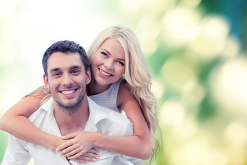 happy couple having fun over green background