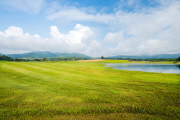 Fototapeta premium grass field with lake