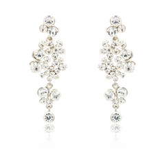 Pair of silver diamond earrings isolated on white