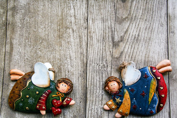 Christmas ceramic  angels on wooden background