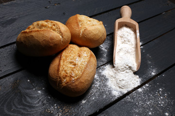 Homemade bread loaf on rustic dark background