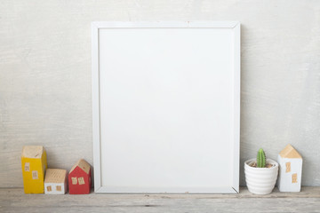 mockup of blank frame poster on wall