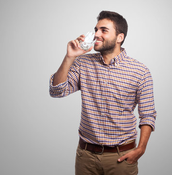 Portrait Of A Young Man Drinking A Water Glass