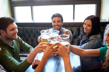 happy friends drinking beer at bar or pub