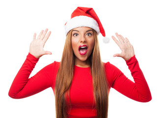 portrait of a beautiful young woman with surprised gesture at Christmas