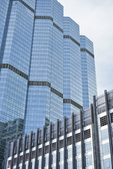 Perspective view to textured background of modern glass building.