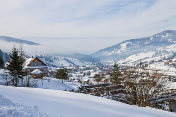 Fototapeta na wymiar winter village landscape in Carpathian mountains