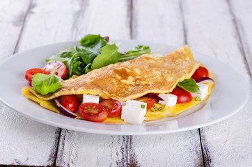 Omelette with tomatoes and cheese