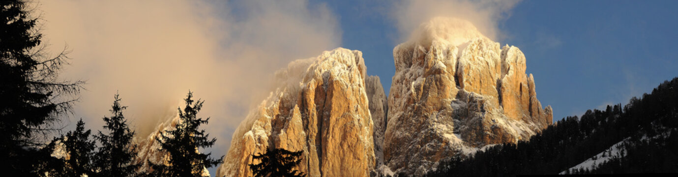 View of the Sassolungo (Langkofel) Group of the Italian Dolomites in Winter from Campitello di Fassa Ski Area in Canazei.