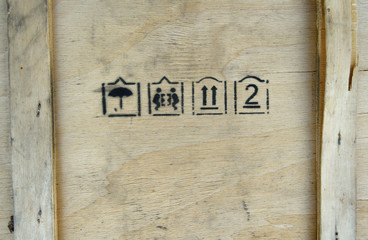 Packaging symbols this way up, keep dry and fragile on wooden bo
