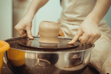 man working on a potter's wheel