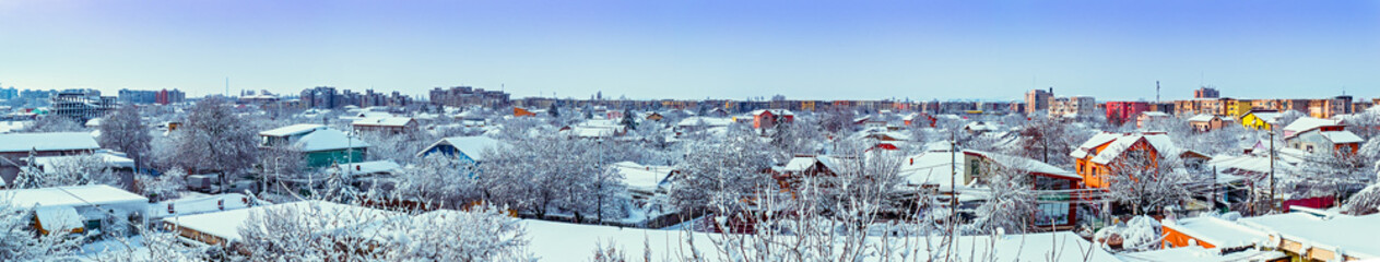 Winter panorama of town at sunset