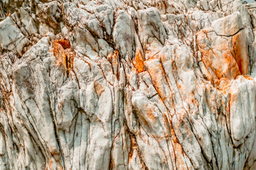 Natural white rock with orange spots