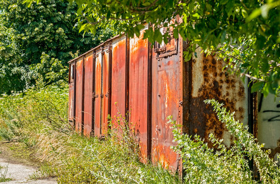 Old rusty railway wagon derelict abandoned in nature