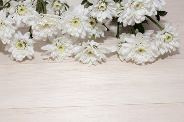 group of white flower on wooden desk,white flower have green leaf,green leaf make oxygen,copy space