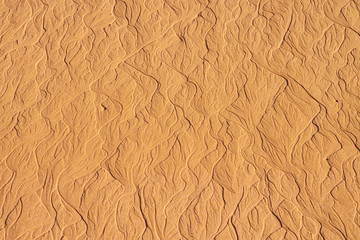 Patterns in the sand on a beach