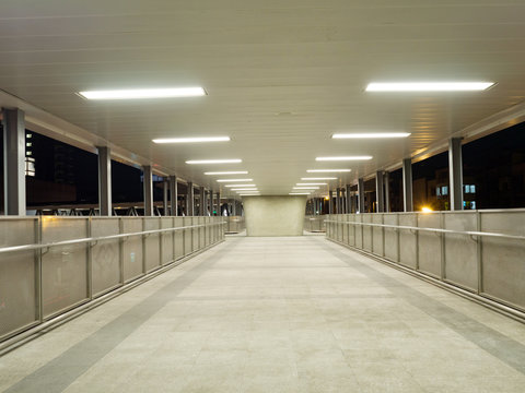 Long corridor overpass interior with light for background.