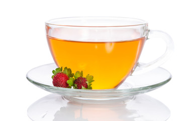 Glass cup of tea with strawberry isolated on white background