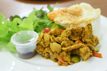 rice, stir fried hot and spicy curry with chicken and fried egg