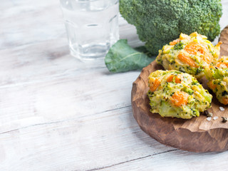 Wooden background with vegetable patties