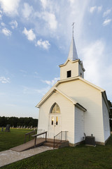 Fototapeta na wymiar Old white country church