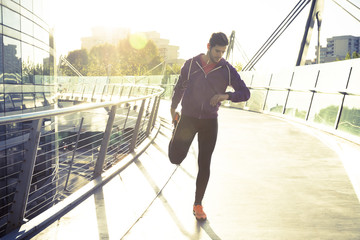 man runner stretching legs before run