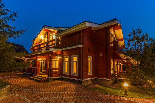 Nice modern wooden house during evening hours.