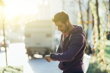 Portrait Of Man With Heart Rate Monitor On Wrist