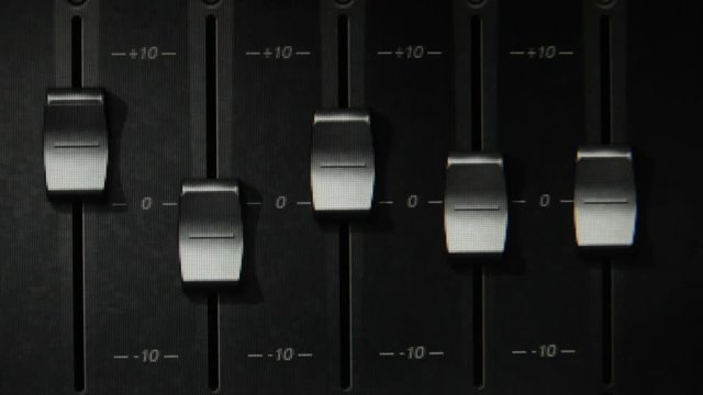 Faders of a digital audio workstation mixer