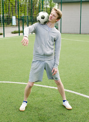 Young man making football freestyle