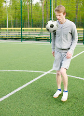 Young man making football freestyle