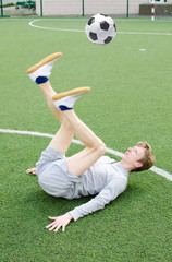 Young man making football freestyle