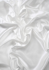 Fototapeta premium Smooth elegant white silk as wedding background