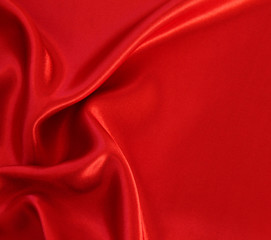 Fototapeta na wymiar Smooth red silk as background
