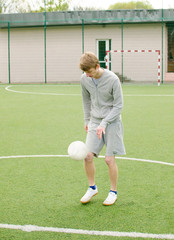 Young man making football freestyle