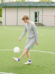 Young man making football freestyle