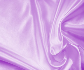 Smooth elegant lilac silk or satin texture as background