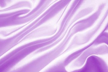 Smooth elegant lilac silk or satin texture as background