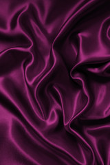 Smooth elegant pink silk or satin texture as background